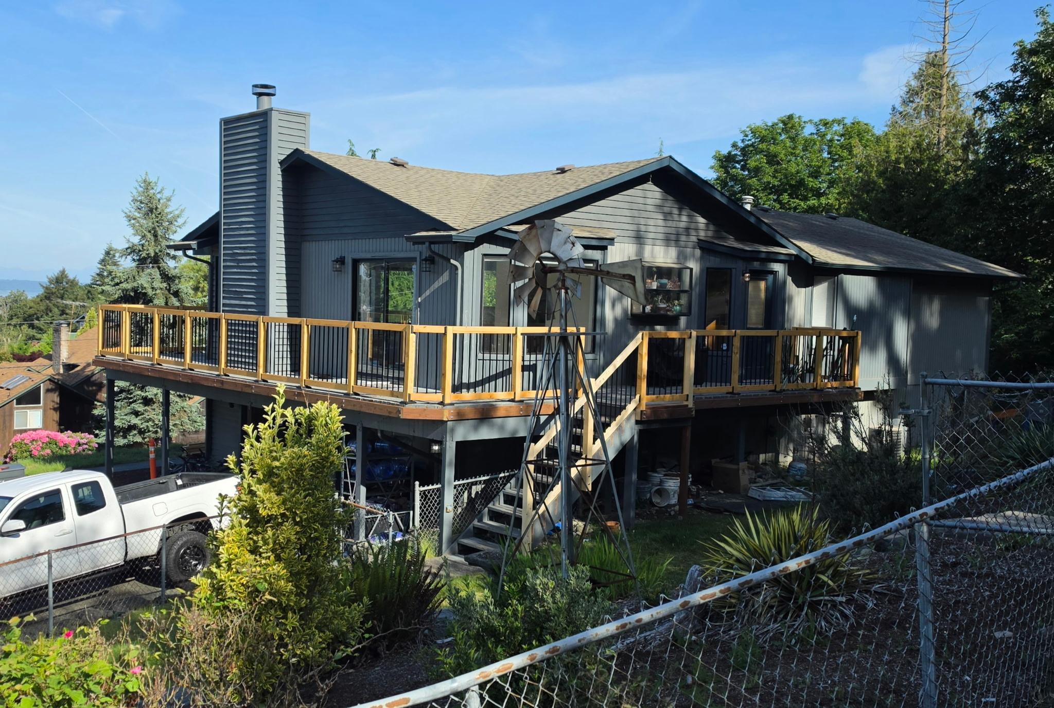 Completed wraparound deck with modern railing
