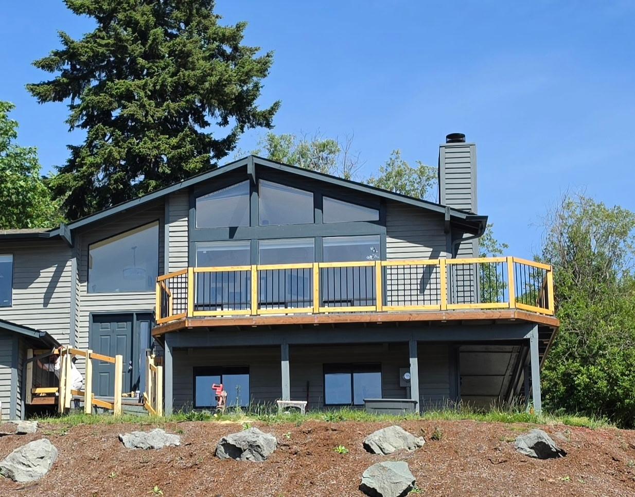 Modern deck on grey exterior home